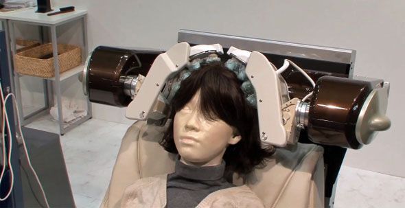 Head Massage Therapy Given To An Experimental Doll By A Robotic Machine.