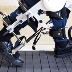 An Image showing a man wearing robotic exoskeleton in his legs.
