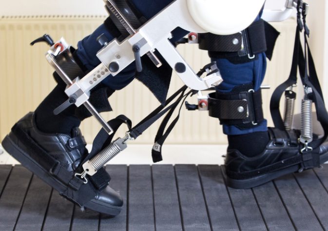 An Image showing a man wearing robotic exoskeleton in his legs.