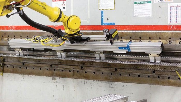 An Industrial Robotic Arm Working In Heavy Fabrication Process In A Metal Fabrication Company