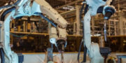 An Image Representing The Robotic Arms In Metal Fabrication Company.