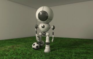 In An Indoor Room Robot Is Getting Ready To Kick The Football